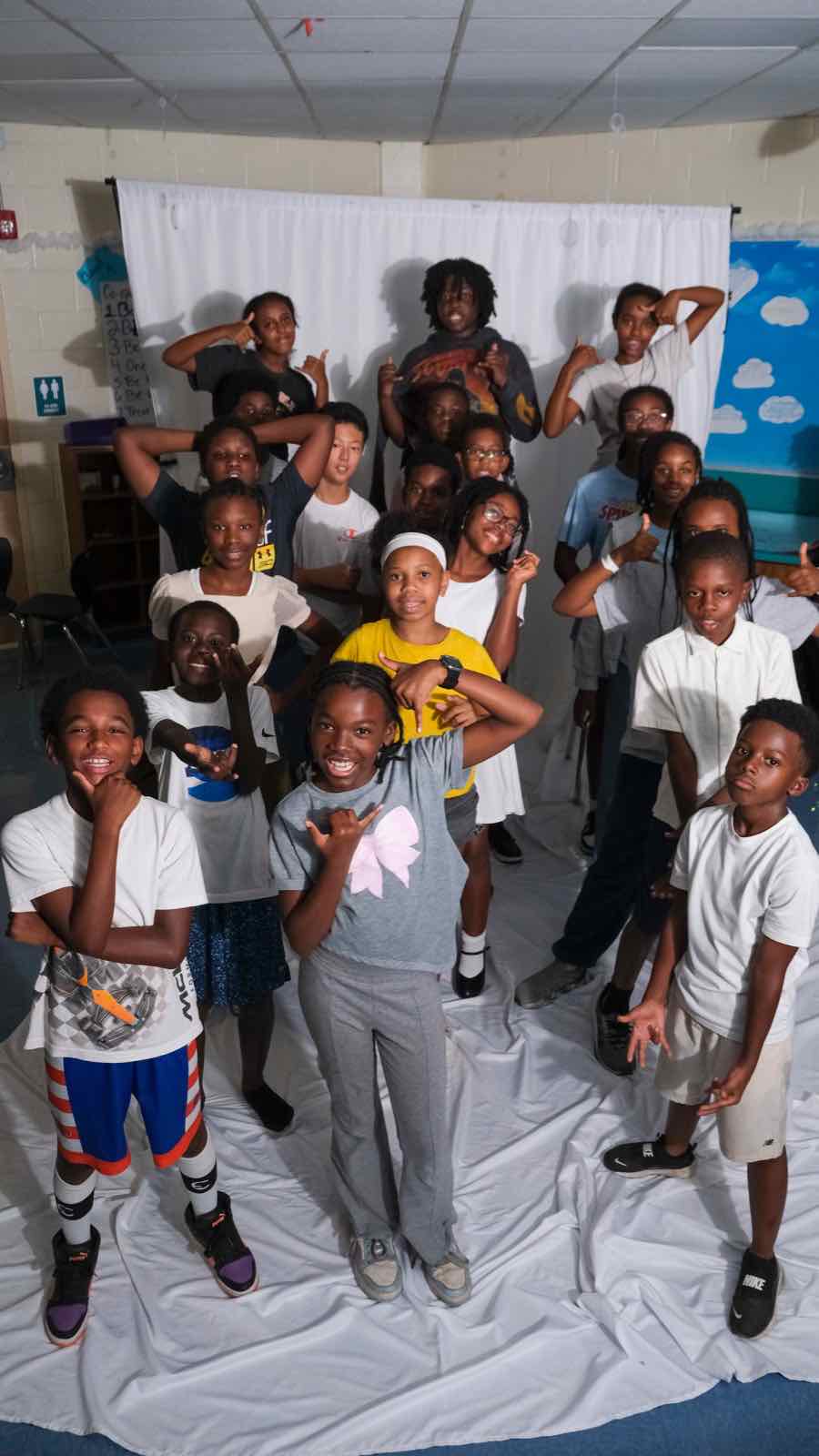 Creator Bound Scholars gathered on the white backdrop at our first Pop-Up Photography Class